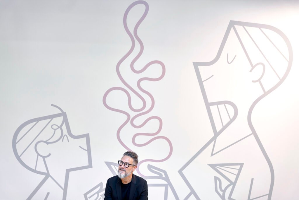Portrait of Ale Giorgini in front of one of his murals — Ale Giorgini