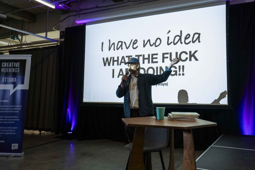 Ben Courtice sur scène à CreativeMornings Ottawa — Boring Friends